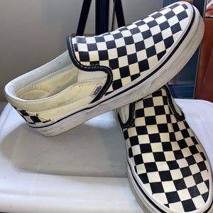 white and black checker vans slip on
